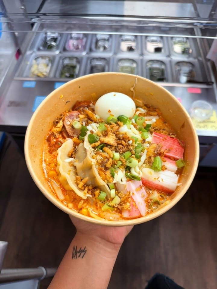 A ramen bowl with toppings at Suki’s.